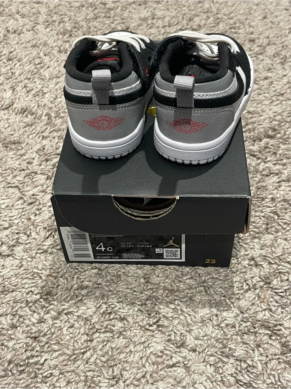 Jordan Black and White Toddler Sneakers with Red Accent
